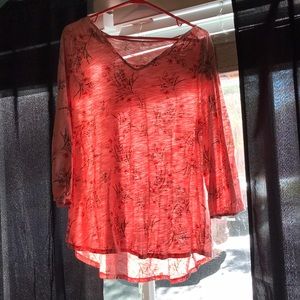Pink floral blouse.